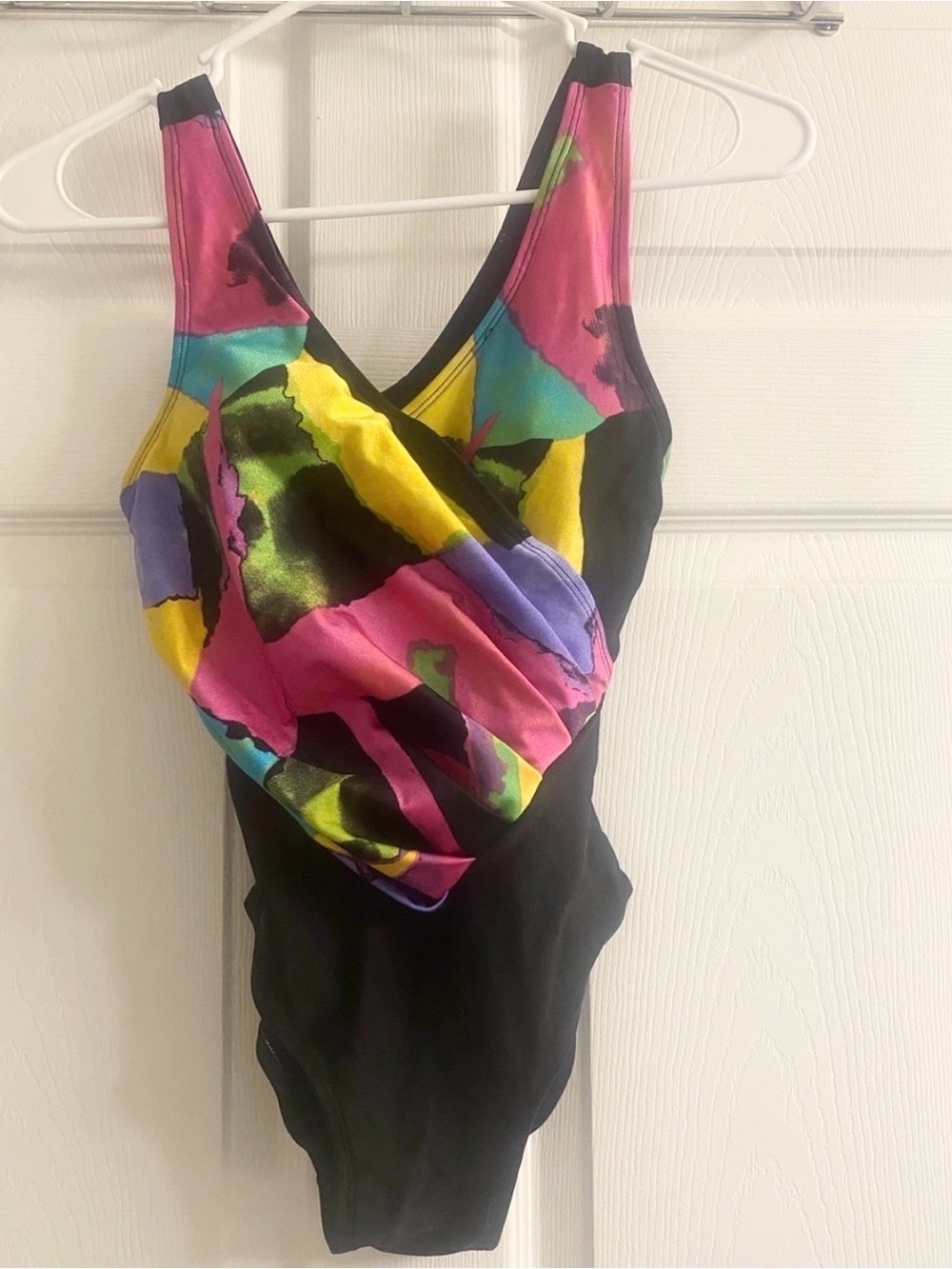 Black One-Piece Swimsuit with Bright Floral Colorblock. 

With removable cups.